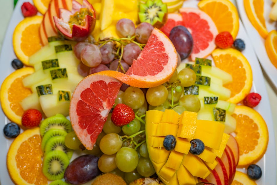 Vibrant and delicious fruit platter featuring grapefruit, mango, kiwi, and more.